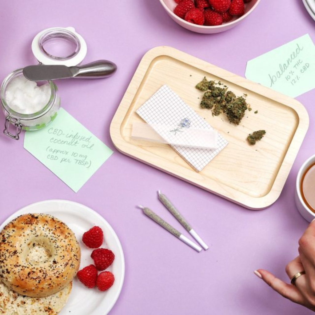 flat lay photography with bagels, prerolls, and fruit